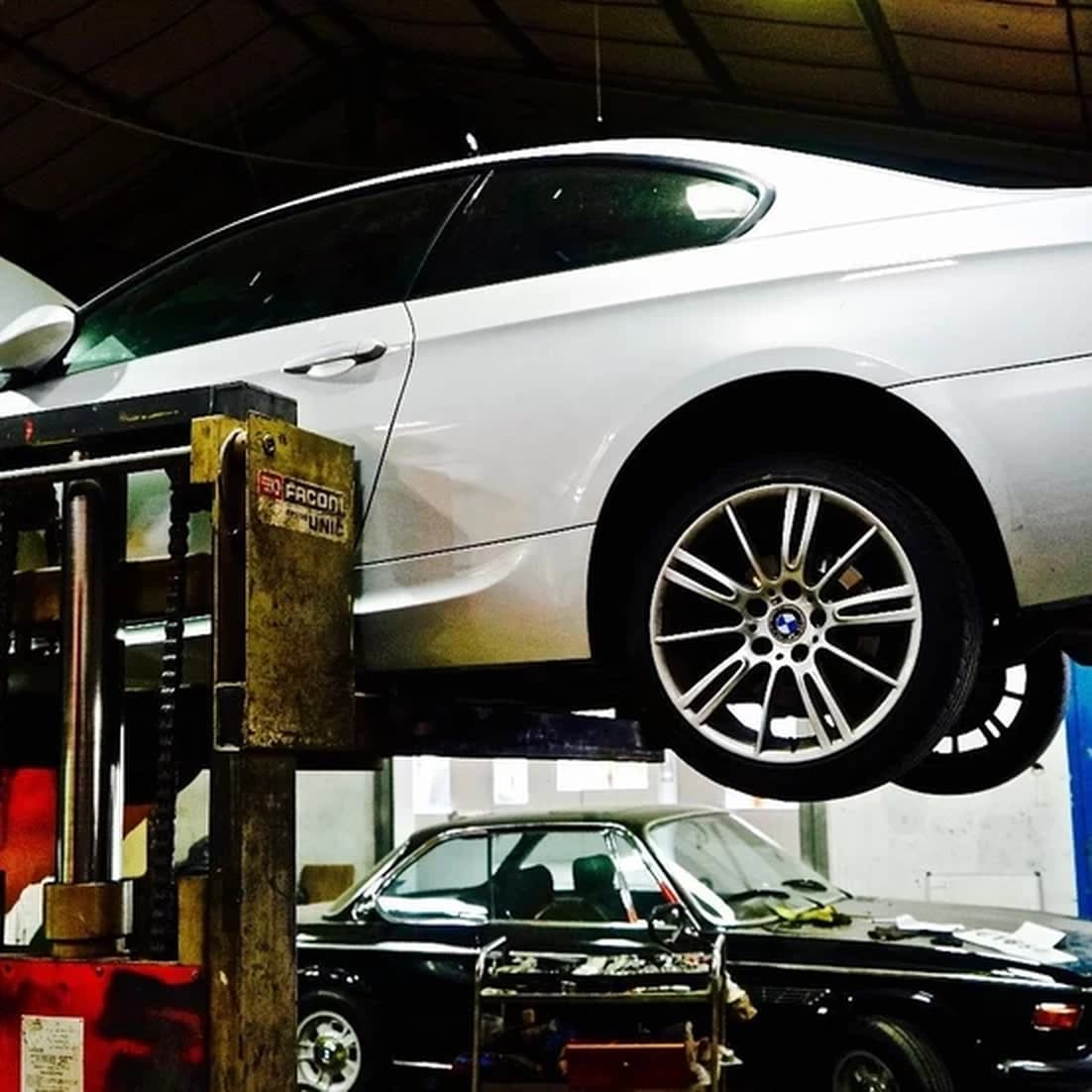 Car on lift in workshop